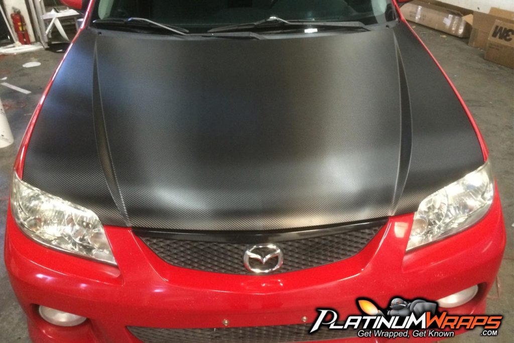 Carbon fiber hood wrap on this mazda